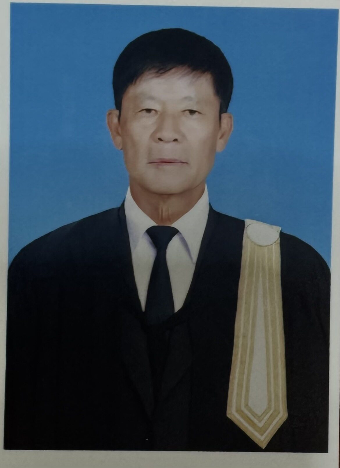 Jittisak Tamprasert in legal robes, reflecting his earlier career as a lawyer.