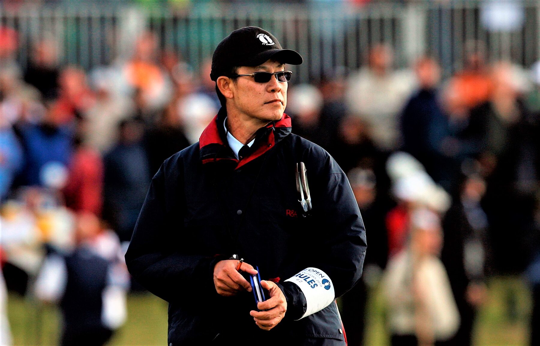 Jittisak Tamprasert working as a golf rules official at The Open
